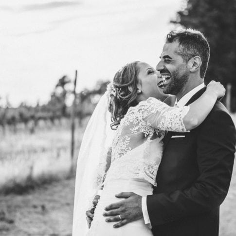 bride and groom smile happy on their wedding day in tuscany